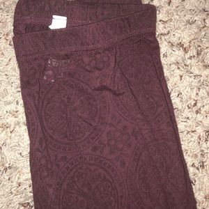 Maroon see through tights with beautiful pattern.